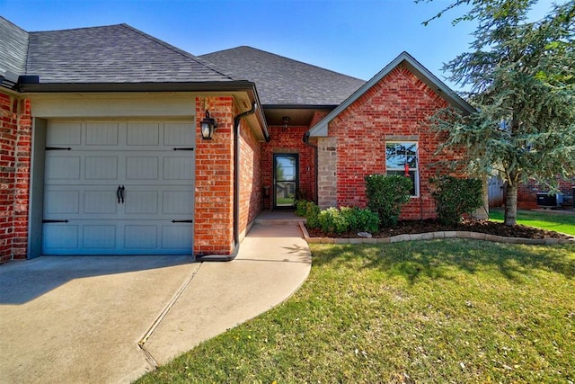 view of front facade featuring a garage, brick siding, concrete driveway, and a shingled roof