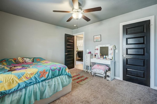 bedroom featuring baseboards, a ceiling fan, and carpet floors
