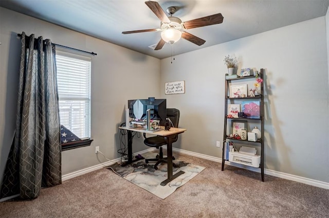home office featuring ceiling fan, baseboards, and carpet