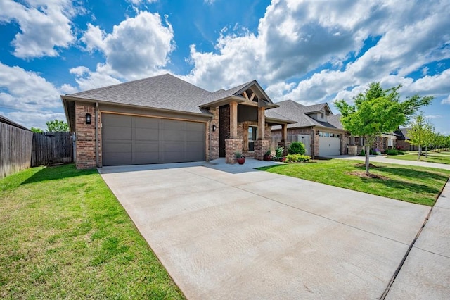 2420 NW 179th Ter, Edmond, OK 73012 - ranch-style house with brick siding, an attached garage, fence, and a front yard