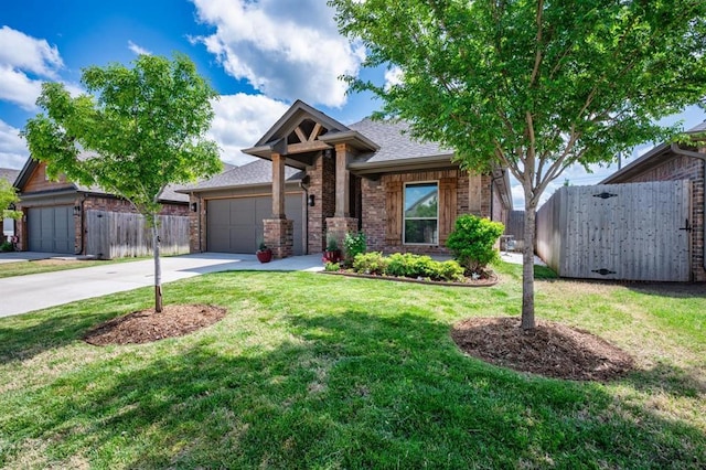 2420 NW 179th Ter, Edmond, OK 73012 - view of front of home with brick siding, fence, driveway, and a front yard