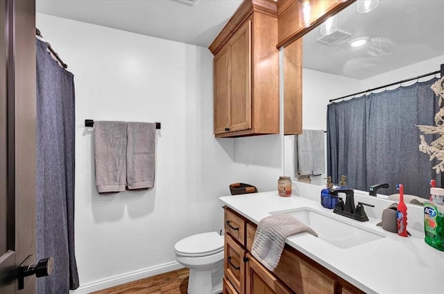 2420 NW 179th Ter, Edmond, OK 73012 - full bathroom with visible vents, wood finished floors, baseboards, vanity, and toilet