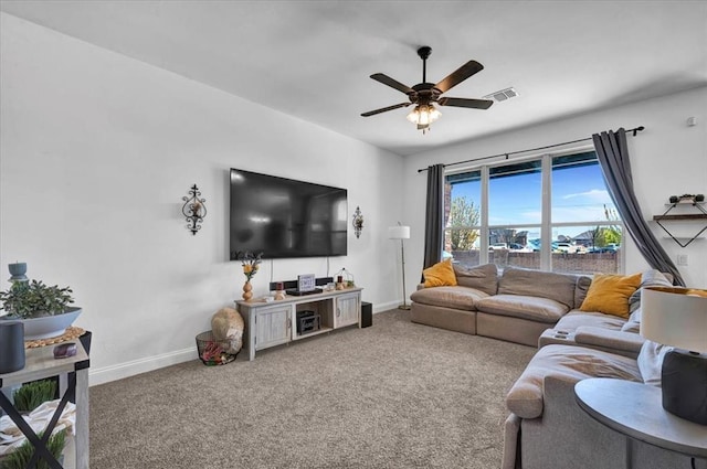 2420 NW 179th Ter, Edmond, OK 73012 - living area with carpet flooring, baseboards, and ceiling fan