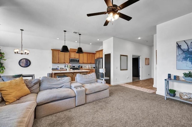2420 NW 179th Ter, Edmond, OK 73012 - living area with light colored carpet, baseboards, ceiling fan with notable chandelier, lofted ceiling, and recessed lighting