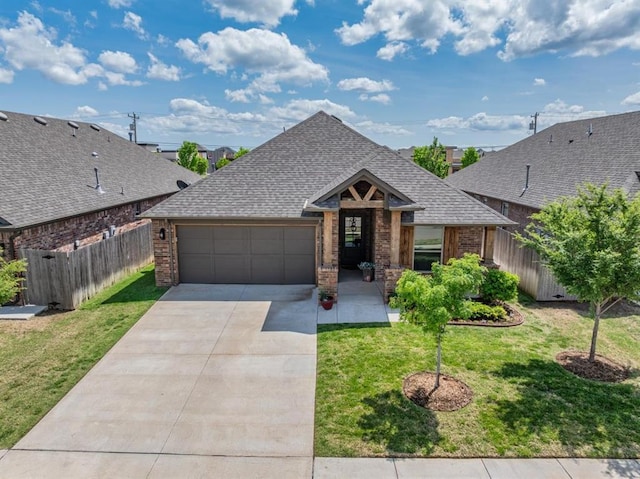 2420 NW 179th Ter, Edmond, OK 73012 - single story home with roof with shingles, fence, brick siding, a garage, and concrete driveway