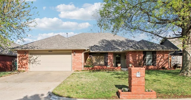 11800 Grande Mesa Ter, Oklahoma City, OK 73162 - ranch-style house with a front lawn, brick siding, an attached garage, a shingled roof, and driveway