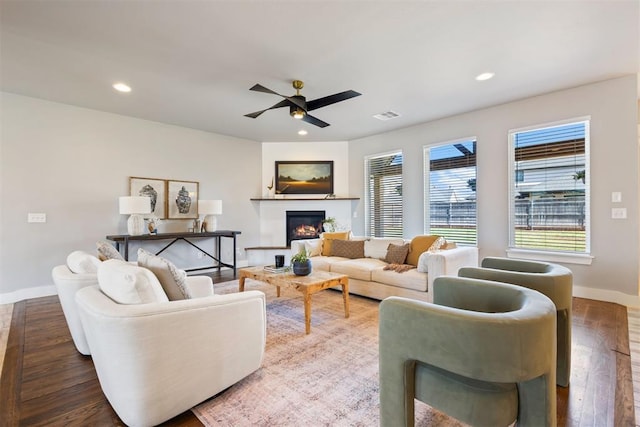 13120 Knight Island Dr, Oklahoma City, OK 73142 - living area with a glass covered fireplace, recessed lighting, a ceiling fan, visible vents, and wood finished floors