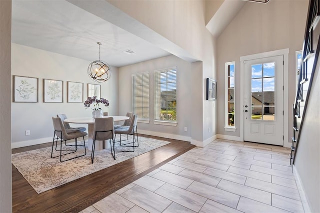 13120 Knight Island Dr, Oklahoma City, OK 73142 - entryway featuring light wood-style floors, baseboards, an inviting chandelier, and visible vents