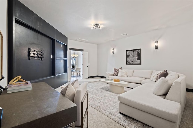 13120 Knight Island Dr, Oklahoma City, OK 73142 - living room featuring visible vents, baseboards, and carpet flooring