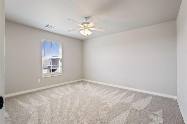 13120 Knight Island Dr, Oklahoma City, OK 73142 - spare room featuring carpet, baseboards, a ceiling fan, and visible vents