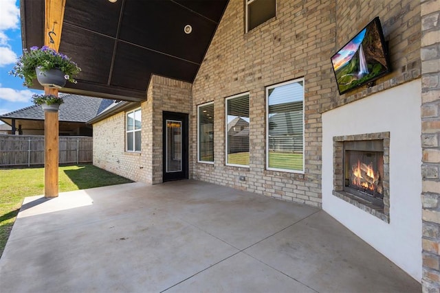 13120 Knight Island Dr, Oklahoma City, OK 73142 - view of patio featuring fence and an outdoor brick fireplace