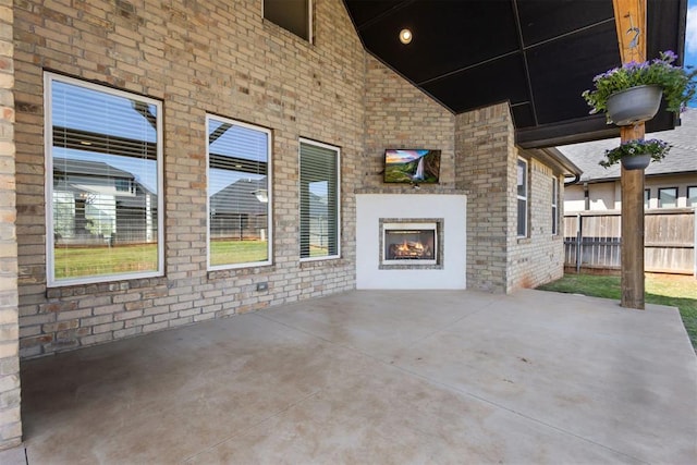 13120 Knight Island Dr, Oklahoma City, OK 73142 - view of patio / terrace featuring an outdoor brick fireplace and fence