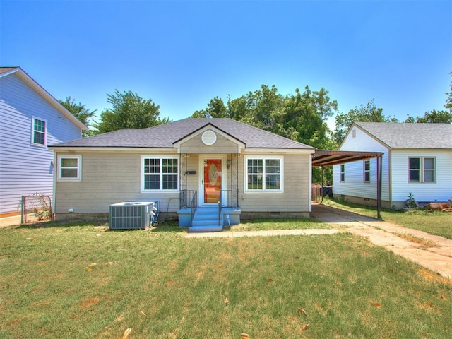 620 SW 48th St, Oklahoma City, OK 73109 - view of front of property featuring a front yard, cooling unit, and concrete driveway