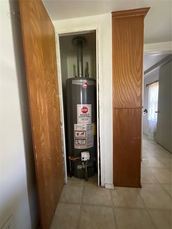 utility room with gas water heater