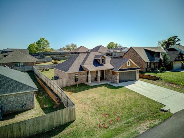 308 W Kerby Ave, Washington, OK 73080 - view of front of house with a residential view, fence private yard, an attached garage, a shingled roof, and concrete driveway