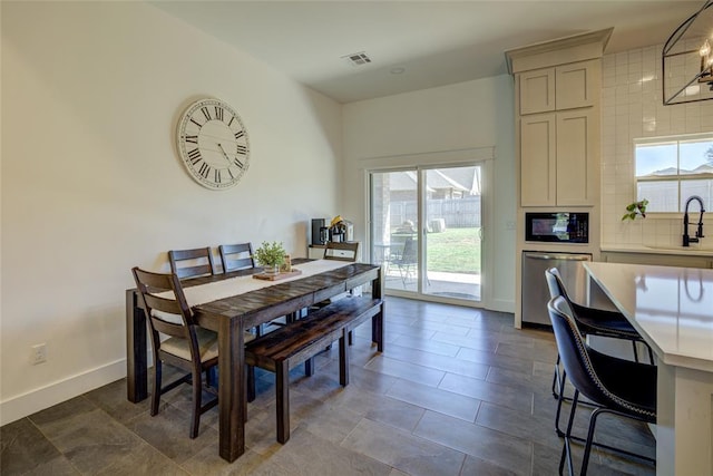 308 W Kerby Ave, Washington, OK 73080 - dining space featuring visible vents and baseboards
