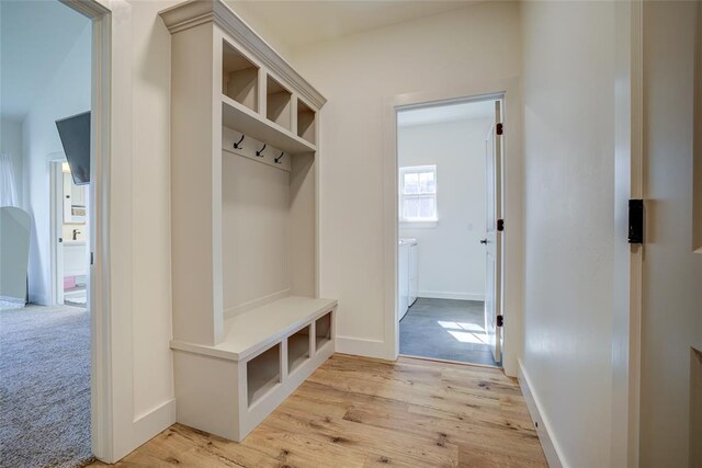 308 W Kerby Ave, Washington, OK 73080 - mudroom with baseboards, light wood finished floors, and light colored carpet