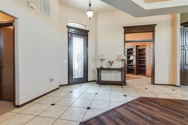 19605 Talavera Ln, Edmond, OK 73012 - foyer featuring light tile patterned floors, visible vents, and baseboards