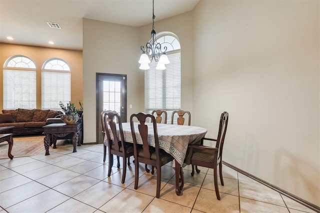 19605 Talavera Ln, Edmond, OK 73012 - dining space with light tile patterned flooring, a notable chandelier, visible vents, and a wealth of natural light