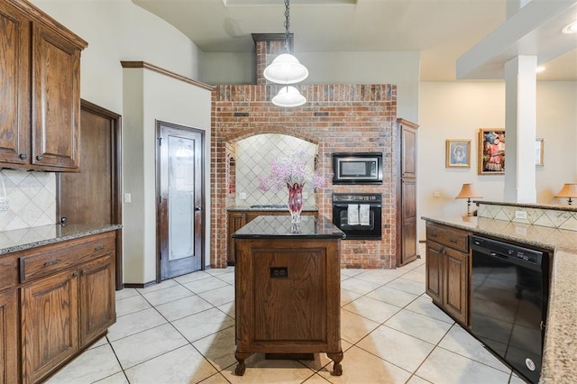 19605 Talavera Ln, Edmond, OK 73012 - kitchen with hanging light fixtures, black appliances, decorative backsplash, a kitchen island, and light tile patterned flooring