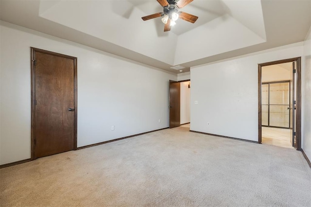 19605 Talavera Ln, Edmond, OK 73012 - unfurnished bedroom with light carpet, baseboards, lofted ceiling, and connected bathroom