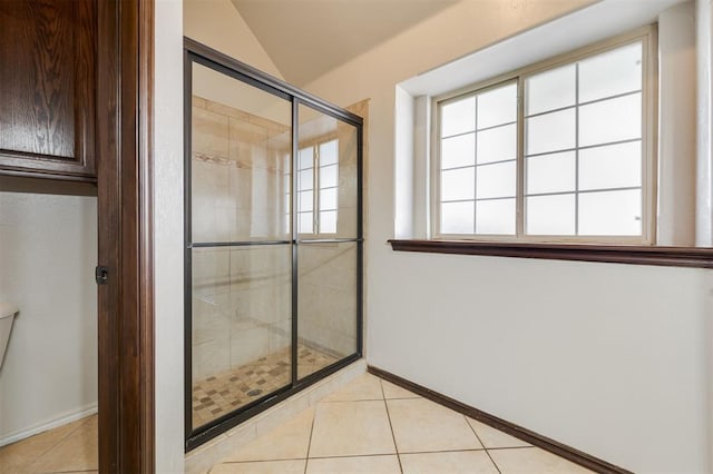 19605 Talavera Ln, Edmond, OK 73012 - full bath with toilet, tile patterned floors, a stall shower, and baseboards