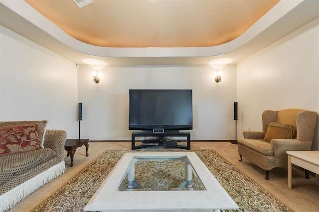 19605 Talavera Ln, Edmond, OK 73012 - living area with a tray ceiling, light carpet, and baseboards