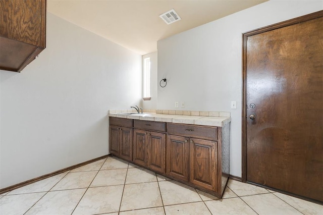 19605 Talavera Ln, Edmond, OK 73012 - bathroom with vanity, baseboards, tile patterned flooring, and visible vents
