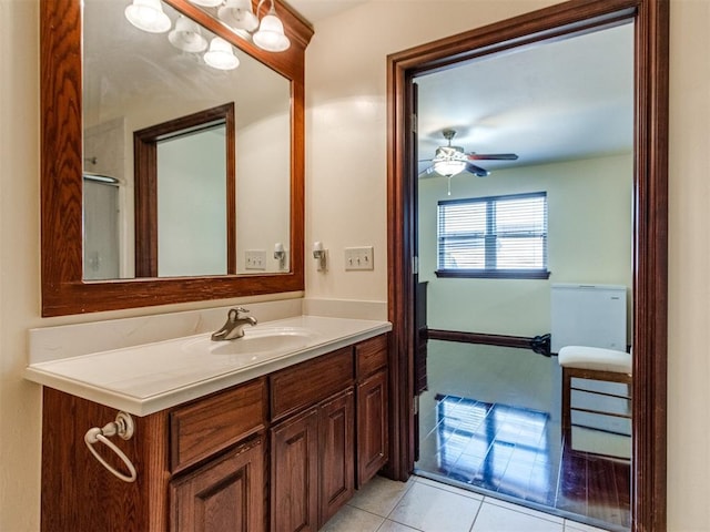 bathroom featuring ceiling fan, tile patterned flooring, and vanity