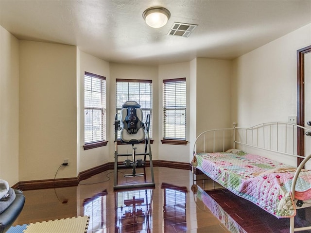 bedroom featuring baseboards