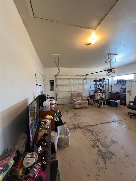 garage with white fridge with ice dispenser