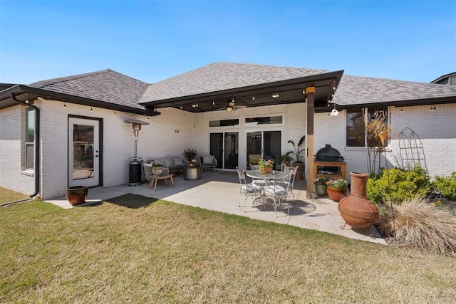 8416 NW 130th St, Oklahoma City, OK 73142 - rear view of property with a lawn, a ceiling fan, a patio area, brick siding, and a shingled roof