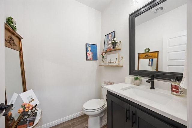 8416 NW 130th St, Oklahoma City, OK 73142 - bathroom with vanity, baseboards, toilet, visible vents, and wood finished floors