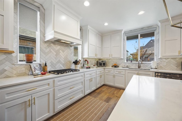 8416 NW 130th St, Oklahoma City, OK 73142 - kitchen featuring tasteful backsplash, white cabinetry, a sink, and appliances with stainless steel finishes