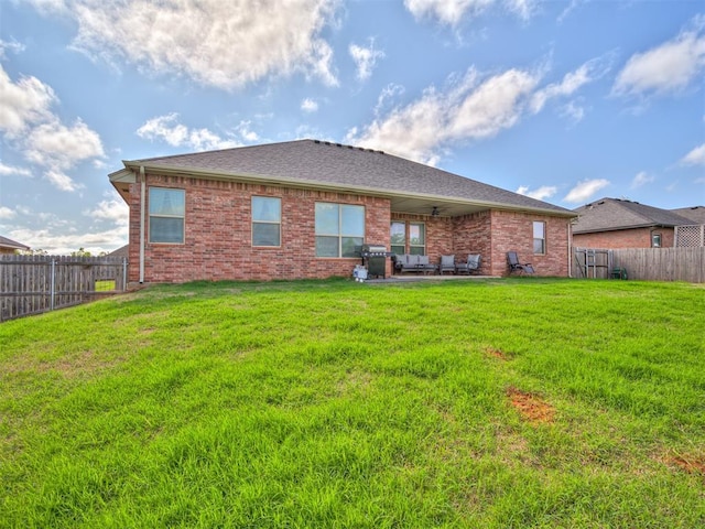 207 Lyla Glen St, Washington, OK 73093 - rear view of house with a ceiling fan, brick siding, a patio area, and a shingled roof