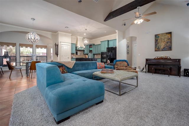 4621 NW 157th Ter, Edmond, OK 73013 - living area with arched walkways, a chandelier, ceiling fan, high vaulted ceiling, and ornamental molding