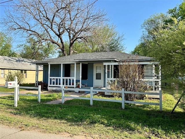 712 1st St, Maysville, OK 73057 - view of front of home featuring a porch, a front lawn, and fence