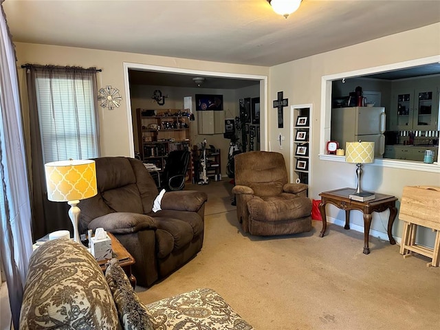 712 1st St, Maysville, OK 73057 - living area with carpet floors and baseboards