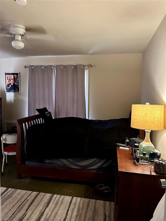 712 1st St, Maysville, OK 73057 - bedroom featuring concrete floors