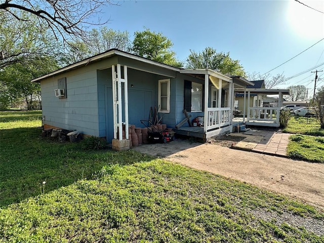 712 1st St, Maysville, OK 73057 - view of front of house featuring covered porch and a front yard