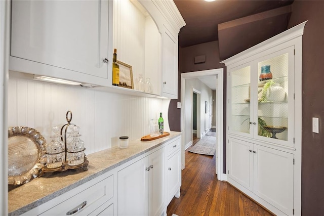 500 NW 41st St, Oklahoma City, OK 73118 - kitchen with light stone countertops, dark wood-style floors, and white cabinets