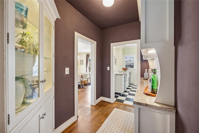 500 NW 41st St, Oklahoma City, OK 73118 - doorway to outside featuring baseboards and wood finished floors