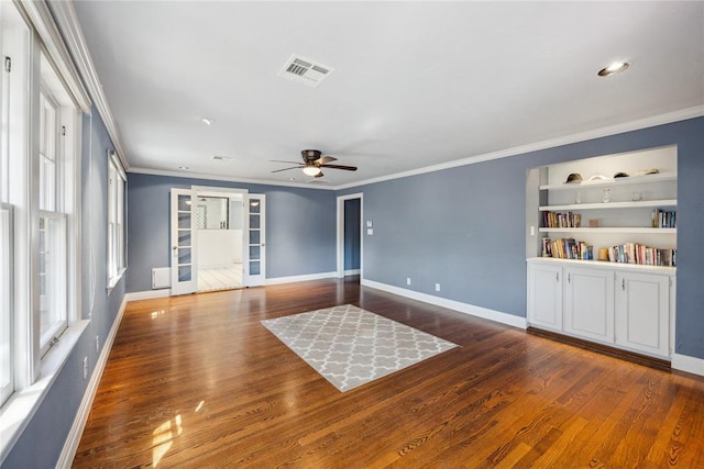 500 NW 41st St, Oklahoma City, OK 73118 - unfurnished room with visible vents, a ceiling fan, ornamental molding, and wood finished floors