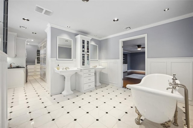 500 NW 41st St, Oklahoma City, OK 73118 - full bathroom with visible vents, a wainscoted wall, a ceiling fan, and a freestanding tub