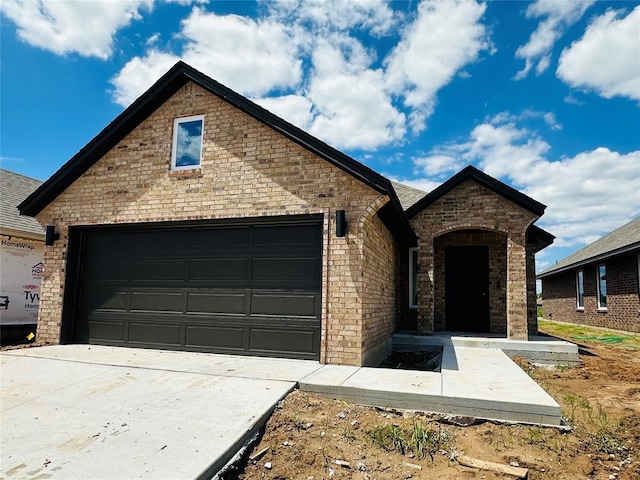 1109 SW 139th St, Oklahoma City, OK 73170 - french country inspired facade with brick siding and concrete driveway