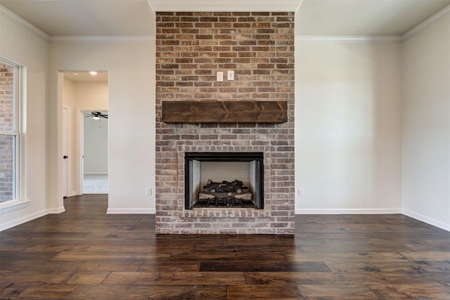 unfurnished living room with a fireplace, wood-type flooring, and ornamental molding
