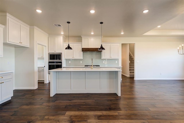 kitchen featuring tasteful backsplash, light countertops, oven, and built in microwave