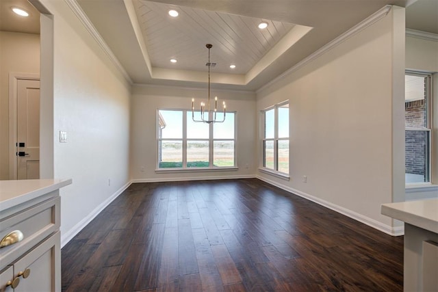 unfurnished dining area with baseboards, a raised ceiling, an inviting chandelier, and dark wood finished floors