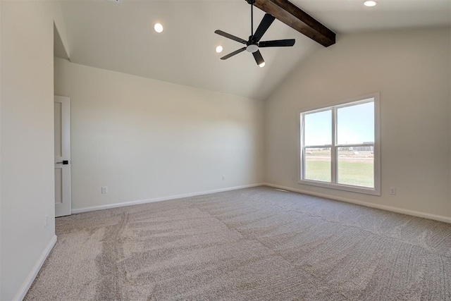 unfurnished room featuring carpet, a ceiling fan, and beam ceiling