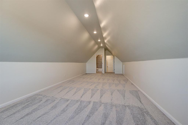 bonus room featuring recessed lighting, baseboards, light colored carpet, and lofted ceiling